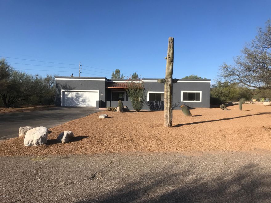 Beautiful remodeled Contemporary home in the Foothills. Private backyard, one acre of land, all new interior finishes. Close to Sabino Canyon hiking, shopping, and restaurants. District 16 Foothills School System. Catalina Mountain Views from Living, Dining, and Master Bedroom. Great Room with Stacked Stone Gas Fireplace. Gorgeous Updated Kitchen w/ Granite Counter tops, New Appliances, Listing Agent is related to Seller.