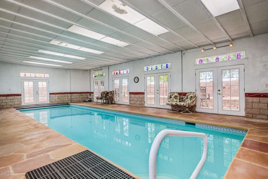 Indoor Pool SANCTUARY! A MUST SEE. One of a kind home! Professional Game tables / lots of furniture included! Granite countertops, Stainless Steel Appliances, Spanish plank tile through the ENTIRE home. This home is impeccably kept- SO unique. No upgrade left undone. Renovated by engineer home-owners who thought of everything. Do you love to entertain? Or just want space for your family to spread out, in a home with open rooms that effortlessly flow into one another. Gorgeous Turf outdoors with as far as the eye can see & PUTTING GREEN, with decked-out cabana and man-cave/she-shed in backyard! Exercise room inside in addition to bedrooms. Huge Game room. Mountain views! New water softener! A MUST COME SEE HOME!
There is nothing like this one!Some Furniture conveys. All game tables include