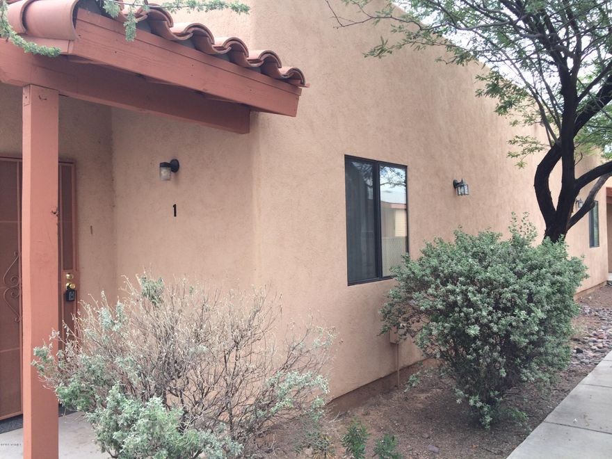 Here's a great 2 bedroom, 2 bathroom unit in a great central location!  One of four units in a modern fourplex, it features tall ceilings, skylights, living room with fireplace, laundry closet with washer & dryer, nice generous kitchen cabinets and cheerful work area, dining area, covered rear patio and small enclosed yard, ceiling fans, refrigerator, oven, dishwasher, covered carport space, and more!  Convenient to shopping, services, restaurants, and the U of A.  Great value at only $800!  Call today! Owner is a licensed real esate agent.