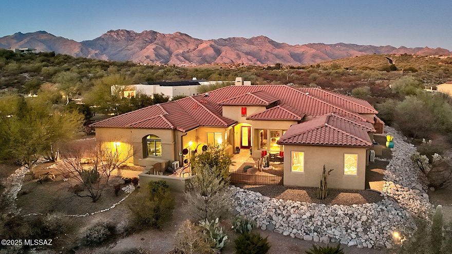 Stunning 2015 Southwestern Contemporary Home with Catalina Mountain Views.  Nestled near River Rd. and Craycroft, this exceptional residence offers 5 bedrooms (including a private guest suite), 3.5 baths, and an expansive 3,621 sq. ft. of living space on a .86-acre lot with breathtaking Catalina Mountain views. An oversized three-car garage provides ample storage.  Step through a lush courtyard entry into the expansive 22' x 22' great room, featuring soaring ceilings, walls of windows, a dramatic stacked-stone fireplace, and seamless flow into the breakfast area and adjacent formal dining room.  The chef's kitchen is a culinary dream, boasting custom cabinetry, a large center island, granite countertops, a stylish glass backsplash, and designer stainless steel appliances— including a wine fridge.  The gracious primary suite is a true retreat, offering a spacious walk-in closet with built-ins, a luxurious glass walk-in shower, a soaking tub, dual vanity, and direct access to the serene backyard.  Designed for resort-style living, the north-facing backyard is an entertainer's paradise, complete with an expansive covered patio, multiple seating areas, a pool, hot tub, sauna, and a dream cabana featuring an outdoor cooking area with a BBQ and a smoker.  With meticulous maintenance and move-in-ready condition, this exceptional home is sure to impress. Don't miss those spectacular Catalina Mountain views!

*Furnishings may be available on a separate bill of sale.