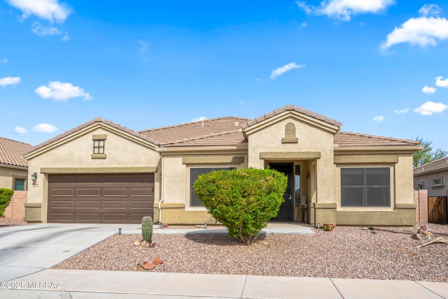 If you want everyday to feel like a vacation, then you need a home with a backyard oasis, and this is the one! This home is part of a 55+ community inside of Saguaro Bloom and has so much to offer. The custom-designed backyard is a true sanctuary, perfect for relaxation or entertaining. Picture yourself unwinding by the warm glow of the gas fireplace, preparing delicious meals in the outdoor kitchen, or savoring the soothing sound of the waterfall feature. With elegant pavers, mature landscaping, and a putting green for leisurely afternoons, this outdoor space is nothing short of remarkable. Inside, the home is equally impressive, boasting an array of upgrades that combine elegance and functionality. The kitchen features extended cabinetry, quartz countertops, a stunning backsplash, a reverse osmosis system, a walk-in pantry, and stainless steel appliances. Each bedroom comes with its own en-suite and spacious closet, offering both comfort and privacy. The primary suite connects seamlessly to the laundry room, which is equipped with beautiful cabinetry and a sink for added convenience. The den provides a versatile bonus space, complete with a closet and the potential to be transformed into a third bedroom. The garage is a standout, featuring epoxied floors, storage cabinets, and a split AC unit, making it a comfortable and practical space. Beyond your home, the Saguaro Bloom community boasts incredible amenities, including walking and biking trails, parks, pools, a splash pad, a gym, and a community center. This property truly offers resort-style living at its finest. Don't miss your chance to own this desert oasis. Schedule your showing today and make your dream lifestyle a reality!