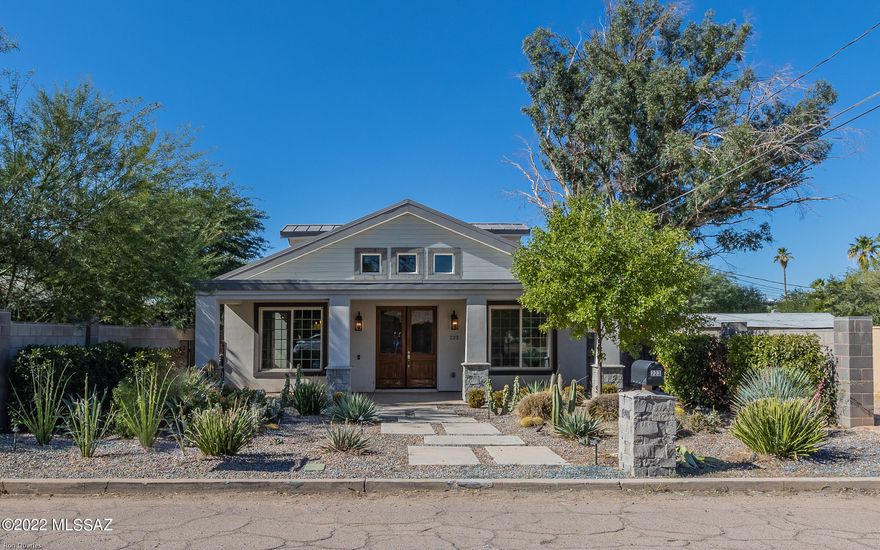 Offers to be submitted on HUBZU website. Rare find FIX-UP with guest house in historic Sam Hughes, minutes from the University of Arizona. Beautiful open floorplan, contemporary farmhouse style, 2085sf house & 747sf guest house.  Great room with a gas fireplace, large front porch, clerestory dormers, metal roof, & roof-top deck/patio. (*Do not leave children unattended.) Spacious master bath, walk-in closet, the garden tub is unattached.  Private pool-size walled yard, double entry gates & a 3-car garage between the house & guest house.  Enjoy sunrises, sunsets, & UA Events from the deck. Drywall cut back, previous water issue. The house could be amazing!  This property is lender-owned, is being sold AS-IS, the seller makes no representations or warranties.