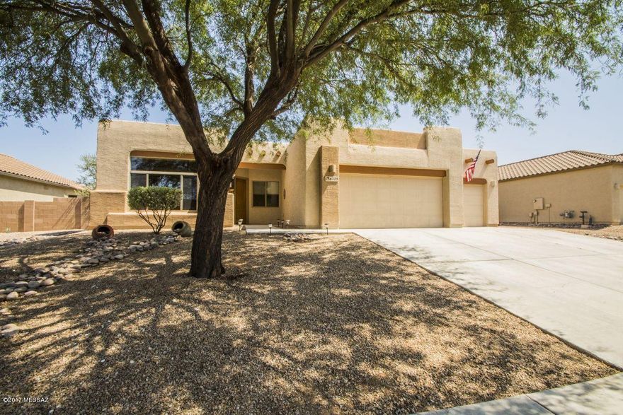 Move-in ready home with breathtaking mountain views in a quiet neighborhood. This wonderful home is close to shopping, parks, Casino Del Sol, Ryan Air Field and so much more. Three bedrooms and a den/office, formal living and dining area, family room has a bee-hive fireplace with a heatilator which warms the home so you don't need to turn on your furnace during our short winter months. Fabulous back yard with fruit trees and lots of room to install a pool later on and the views are wonderful from the covered patio. The 3-car garage has a 220 outlet and several 110 outlets, professional grade street shelves and 3-wooden cabinets. The roof was recently coated by a professional roofing company so no need to worry about roof issues. Carpets throughout home were just shampooed. Sellers are leaving all the appliances so all you need to bring are your personal belongings and this will be your home. Sellers are offering a 1-year home warranty that will cover all the appliances. The TV, TV mount and the surround sound speakers in the family room will not convey. This is a wonderful home in a great area and it's priced to sell. Come and tour the home an you'll fall in love and want to make it your own.