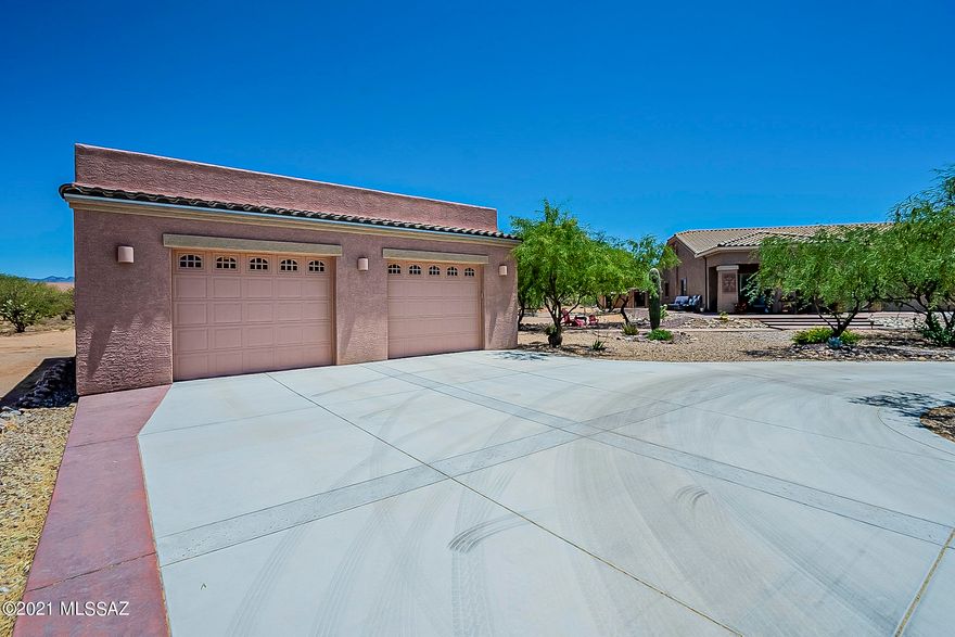 Home sweet home! Located in Sahuarita Highlands, this immaculate 1.98 acre desert oasis home is surrounded by desert life & tranquility yet is within 10 min of shopping & amenities. So many upgrades & improvements you just have to see it! Bright & spacious w/vaulted ceilings, formal living & dining room, family room, 3 bdrm, den/office. Flooring is hardwood, Italian tiled & upgraded carpet. Wood shutters and honeycomb blinds, pendant lights & chandelier. Gourmet kitchen with/ceramic sink, granite counter tops, SS appliances, double oven & large eat-at island. Garage has epoxy floor coating. RO filtration & water softener. Sparkling fiberglass saltwater pool w/cool deck. Large covered patio, Garden bed w/drip irrg, predator-free system & shed. Owner has even created a rain harvesting system Washer & Dryer do not convey.