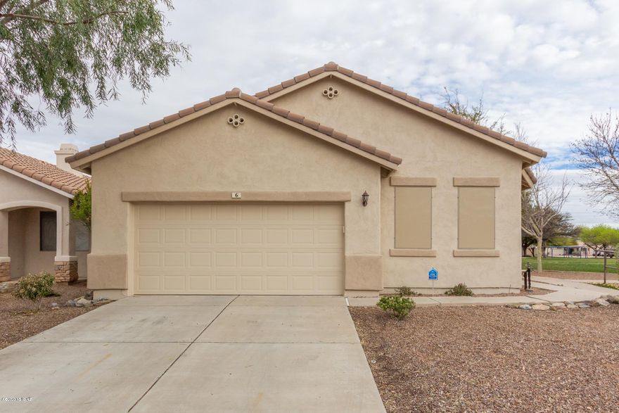 Beautiful turnkey home next to a lovely community park available in prestigious Rancho Sahuarita. Wonderful community with superb amenities including a pool and spa, rec center, tennis, basketball and more. Inside is bright very well maintained. Spacious open floor-plan is perfect for entertaining. Living area features a charming fireplace and a built in entertainment center. Island kitchen with ss appliances. Tile in all common areas with carpet in the bedrooms. Neutral paint tones throughout. Master bedroom includes a huge walk-in closet and a private en-suite with dual sinks and a separate soaking tub and shower. Inviting backyard with low maintenance landscaping, an extended covered patio and views of the park. Dont hesitate or you will miss it. Call to schedule your showing today.
