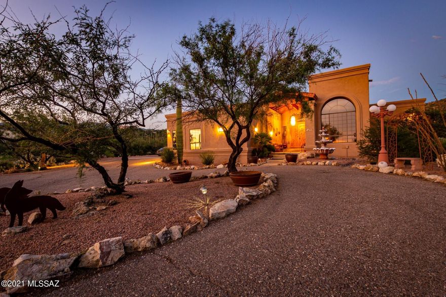 Gorgeous four bedroom home near Agua Caliente Regional Park! Wonderful curb appeal, circular driveway, 3 car garage, delightful fountain, & dense desert landscape. Enter through the covered entryway & the iron door to discover a great room, striking vaulted ceilings, formal dining, and a sunken living room with immaculate Mountain views! Kitchen features ample cabinets, SS appliances, a pantry, an island with breakfast bar, & granite countertops. Main retreat boasts a sitting area, access to the enclosed patio, & lavishing ensuite with granite countertops, jetted tub, & a sit-down shower. Loft has access to the terrace where you'll enjoy every breathtaking sunset Tucson has to offer. The bonus room with fireplace & wet bar was made for entertaining! Large backyard comes with a sparkling pool, fire pit, & amazing Panoramic Mountain Views!