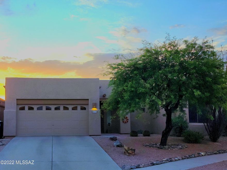 OPEN HOUSE 6/25 10am-3pm Nestled in a quiet cul-de-sac in NE Tucson is this serene Santa Fe style 3 bed/2 bath. Natural light fills the home through the large windows, skylights, and French doors that open off the primary suite and great room to a tranquil east facing backyard. The large covered flagstone patio is perfect for sunny mornings and shady afternoons. Yard borders an undisturbed natural desert common area with views of the Catalinas and Rincons. SS appliances, gas range, ample storage, built-in pantry, and bar seating that opens to the spacious great room and dining area. Primary suite has large walk in closet, dual vanity, linen closet, and walk-in shower. Guest bath has granite counters and a large walk-in shower. Two car garage. Laundry room with storage. Washer/dryer convey