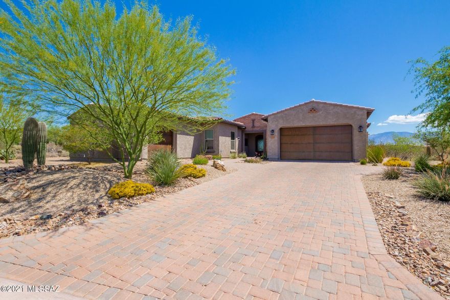 Step into this meticulously maintained home with breathtaking Mountain views and many upgrades. Enjoy the spacious open floor plan, handsome wood look tile floors, with a den & formal dining room. Stunning chef's kitchen features a center island with quartz counters, breakfast bar, pendant lighting, SS appliances including a Dacor refrigerator. Large panty & gorgeous wood cabinetry with crown molding fill out the kitchen.  Breakfast area has natural light and patio access. Additional carpeted living area which can be used as a great office or den. Grand master bedroom boasts a sitting area, bathroom with dual sinks and a walk-in closet with a built in California Closets arraignment. 3-Car garage is insulated with epoxy floors & cabinets. Sensational backyard with a covered travertine pati Breakfast area has natural light and patio access.  Large laundry room with storage cabinets & sink!