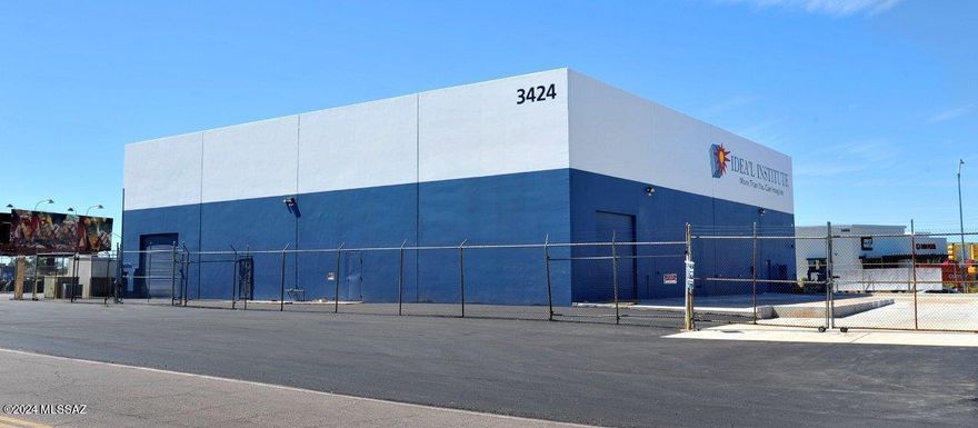 Location, Location, Location.   This commercial building has it all.  Over 10,000 sq. ft of warehouse space with multiple roll up garage doors, concrete ramp and four bathrooms. There is also an additional 1500 sq. ft, 2 story office space consisting of 7 offices, training room, viewing room and air conditioning.  The over ½ acre lot is fenced with security fencing and has a newly paved parking lot.  
Located amongst the hottest growing sector in Tucson with many new restaurants, retail shops, hotels, Costco, Movie Theatre, Dave and Busters.  Only minutes to the Airport, I-10, Gem shows and the University of Arizona.
The building is also for lease for $12,500 a month, NNN.  Triple Net.  Seller is willing to carryback the loan depending on terms and conditions.