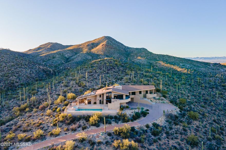 Best Views on the Westside! Stunning city and mountain views from every window in this beautiful, spacious golf course community estate. The private, gated driveway leads to the most striking viewpoint in Starr Pass from this secluded 3.3 acre custom property. Some of the features include an elevator, 3 fireplaces, guest quarters with kitchenette, laundry on both levels, a 4 car garage, new pool heater, resort like yard, and energy efficient solar panels. Schedule your private showing today.