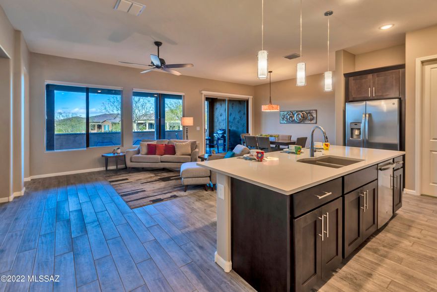 Beauty, charm, and a prime location highlight this wonderful villa. Step inside and you will be captivated by the open and airy spaces throughout. This Viva model, completed in 2019, is 3 years young and meticulously maintained. Upgrades throughout include, cabinets, counter tops, designer backsplash, SS appliances, and tile floors. Laundry room cabinets provide additional storage and the linen cabinet off the Owner's suite is a dream. The spacious den is perfect for your home office or library. Split floor plan offers privacy for you and your guest(s). Leave the exterior maintenance and yard work to the HOA and begin enjoying all SaddleBrooke Ranch has to offer the moment you arrive at your home. Covered back patio faces the arroyo and provides privacy when desired. Must see!