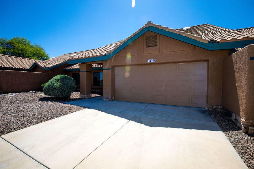 Beautifully remodeled modern contemporary home in prestigious gated community of La Reserve in Oro Valley.   Open concept kitchen with large kitchen island and vaulted ceilings.  Spacious minimalist design with stained concrete flooring, custom cabinetry, quartz countertops, newly tiled showers, new black fixtures and stainless steel appliances.  Heated community pool with mountain views just short steps away.  Must see! Owner/Agent
