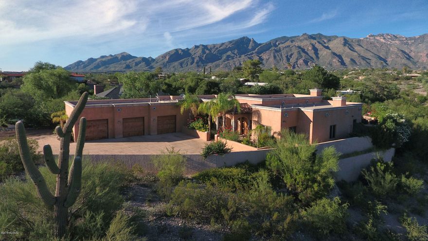 This magnificent 4BR/3.5BA estate in the foothills was designed with luxury in mind.  A dignified courtyard entry is an impressive introduction to the grand foyer beyond.  High ceilings, travertine tile flooring, designer fixtures and high end finishes complete the exceptional design. Gorgeous gourmet kitchen has every asset imaginable including wine fridge, commercial gas range, double ovens & instant hot water pot filler. Master suite with fireplace, oversized bathroom & walk-in closet.  4th bedroom has been converted into a stunning dressing room and has attached bath.  Backyard is made for relaxation with tranquil fountains flowing into the pool, elevated spa, fire feature, outdoor kitchen, fireplace, covered patio and mountain views. 3-car garage & No HOA.