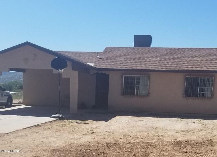 This  long private  driveway is all concrete leading you into this bright Stater Home with 3 bedrooms and 2 bathrooms, heat pump with an acre of land. So your family can enjoy the spacious backyard.