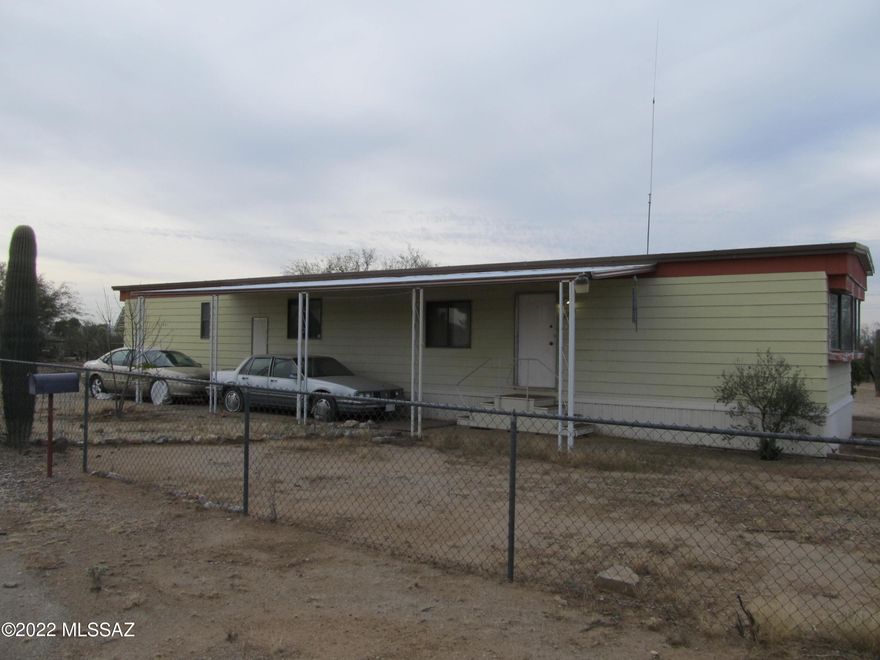 Nice and clean 1 acre parcel with a 2 bedroom 2 bathroom Mobile home. Horse property. Paved roads all the way. Quiet street. Natural vegetation. Completely fenced with chain link. The Mobile home is in good shape and has all the appliances including refrigerator, washer, dryer. Move in ready. No HOA of course.