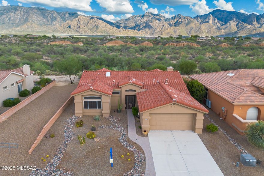 If you've been waiting for gorgeous views and a move-in ready, stunningly updated home in coveted Sun City Oro Valley, this could be your lucky day! You'll want to move right into this beautiful, fully remodeled home & begin your active adult lifestyle. Boasting high quality custom finishes, this Windsor-model home is a showstopper. You'll enjoy the East-facing Catalina Mountain views from almost every room, as well as from the expansive, paver patio & beautifully maintained backyard. This gorgeous home features tile flooring throughout, many sparkling new windows, new HVAC, updated lighting, open (walls removed) great-room design, gas fireplace & so much more! The stylish, remodeled Chef's kitchen features modern stainless-steel appliances, updated shaker-style cabinets, quartz countertops, tile backsplash & a large island w/breakfast bar. Enjoy the Catalina Mountain views from the kitchen and family room, as well as from the great room & dining area. The spacious master bedroom is a comfortable retreat featuring mountain views from the bay window, plus an expanded en-suite bath with quartz-topped dual vanity, large soaking tub & custom walk-in shower. The roomy guest bedroom has plenty of closet space & is located next to the updated hall bath showcasing a quartz countertop & tiled shower. Enjoy outdoor living in the peaceful, easy-care backyard as you soak in the gorgeous Sonoran Desert & panoramic views of the Catalinas. It's hard to find a home that has it all - views & updates - in Sun City Oro Valley. Don't miss your opportunity to own a small slice of heaven on earth!