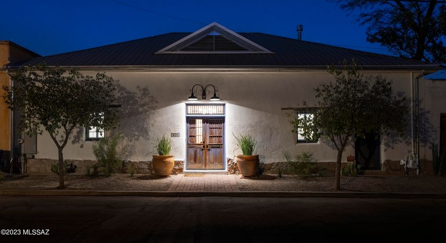 This sensitive and ambitious restoration reimagined by renowned preservation architect Bob Vint, retains the essence of the original architecture circa 1898, whilst creating a renewed vision of amenities and services an owner would expect from a home of this caliber. Located in the heart of the highly sought after Barrio Viejo community, the fit out and quality of finish of this incomparable residence, preserves and protects the vision articulated in this romantic regional aesthetic. The extensive remodel meticulously restored original details, while infusing the latest modern advancements and curated materials, sourced from around the world. Interiors feature a collection of clean, but variously textured walls, a visual study of its environment, where color, shape, light and shadow seduce the endless combinations of this stunning vernacular home. The tradition-infused mud adobe materials, juxtaposed against naturally aged patina, creates warm and inviting spaces that engage the human spirit.

The main Zaguan opens onto the sophisticated formal living room featuring the original Saguaro ribbed viga beamed ceilings, with classic red brick floors that float seamlessly throughout the space, providing a subtle, yet delicate contrast to the vertical wall tones. Accommodations are allocated across the residence, with three bedrooms, including the principal suite, featuring dual dressing closets flanked by the sumptuously appointed primary bathroom, inclusive of a large walk-in shower and radiant heated floors. 

The heart of the home is the fabulous Chef's kitchen with impeccable fit and finish throughout, including custom cabinetry, top-end stainless steel appliances, and honed granite countertops, offering an array of surface counter space. East facing windows from the kitchen and interior breakfast nook overlook the garden courtyard, with a soothing water element that acts as an escape from the hustle and bustle of the city-life, where light and shade, openness and enclosure, make for an inviting ambiance, emphasizing enjoyment as a key element of the outdoor lifestyle.

Additional Details:

Remote gated access is provided off of Rubio Avenue to the East of the property, with a meandering drive that arrives at your own private motor-court with covered parking, and an ancillary storage/workshop structure, easily converted to a guest casita, if so desired. 2-800 gallon water harvesting tanks, assist in efficient landscape water usage, along with a whole house reverse osmosis and water treatment system that supplies water throughout the residence. Historic tax reduction for owner occupied - 2023 property taxes listed as $2,708.46. Nestled on the prominent Convent Avenue, this property is conveniently located within literal steps of all that the downtown corridor has to offer.
