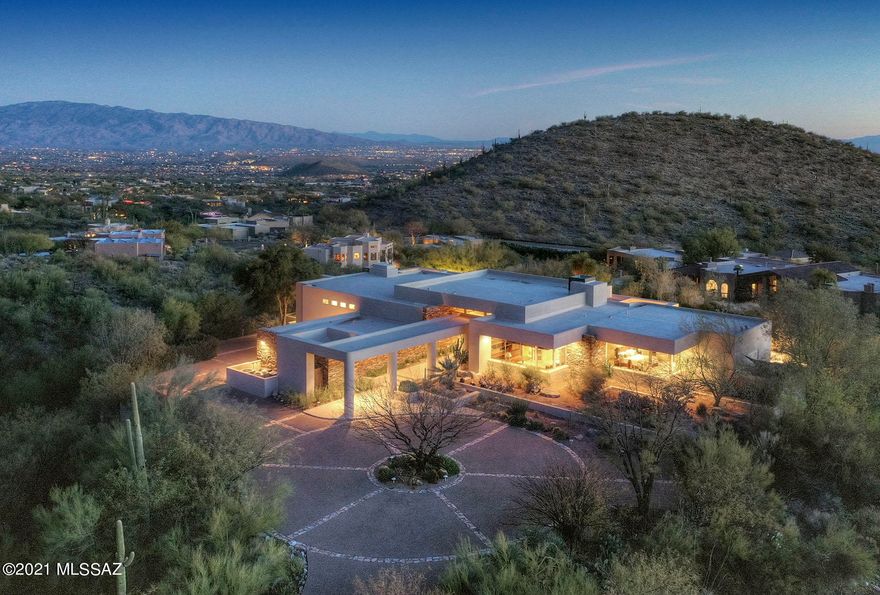 Breathtaking, awe inspiring, unspoiled natural desert - all this & more comes to mind as you tour this phenomenal property. Sitting high up in the desirable Finisterra subdivision, the large lot provides total privacy as you to relax in your negative edge pool & conventional spa. Cooking is a breeze in this bright open gourmet kitchen. Most rooms have ceiling to floor windows allowing for panoramic views and there is potential for a 2nd master or huge guest suite. Gorgeous stacked stone entryway, enormous walk in master closets, green marble master bathroom, polished travertine floors & since we're all spending more time at home, don't miss this opportunity to convert the extra room into your office & upgrade your views with those of the city lights and the Catalina mountains!