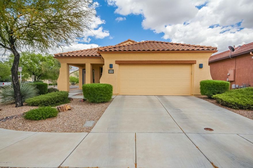 This beautiful home has been lovingly maintained by the original owners. This home is situated on a premium corner lot with no neighbors to the rear. You'll love the wood laminate floors and tile throughout the living areas. Home exterior was painted in May of 2017. The bright open kitchen has corian counters, black appliances and a large pantry.  Large master bedroom with bay window. Home has ceiling fans throughout and surround sound pre-wiring.  One of the guest bedrooms includes a beautiful built-in Office / Murphy bed! Enjoy the walking/bike trails throughout the community, multiple parks, dog park, community center, as well as the heated community pool.  This home is turn-key and includes the natural gas grill (Connected to gas stub) and all the appliances!
