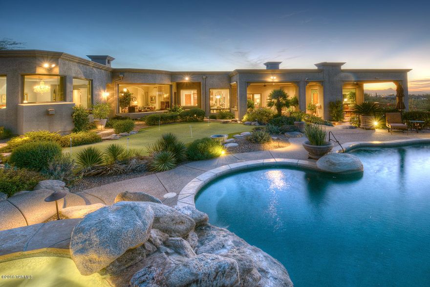 Elegant 4 Bedroom & 5 Bathroom Masterpiece in Pima Canyon Estates. Fine Finishes Throughout, This Home Features a Spectacular Living Room w/Floor to Ceiling Mountain View Windows & Fireplace,Formal Dining Room That Opens to a Covered Patio w/Fountain & City Lights,Spacious Island Kitchen w/Magnificent Mountain Views That Opens to The Family Room w/Custom Built-In’s & Fireplace,Luxurious Master Suite w/Huge Mountain View Windows,Oversized Walk in Closet,& Bath w/Spa Tub & Walk Thru Shower,Executive Office/Den w/Built-In’s,Separate Guest House w/Living Room,Kitchen,Bedroom,& Bath w/Steam Shower,4 Bay Garage w/Epoxy Floors & Large Storage Room, Private Outdoor Living Space w/Oversized Covered Patio,Rolling Shade Screens & Fireplace,Sparkling Pool,Spa,Putting Green,& Commanding Mountain Vi