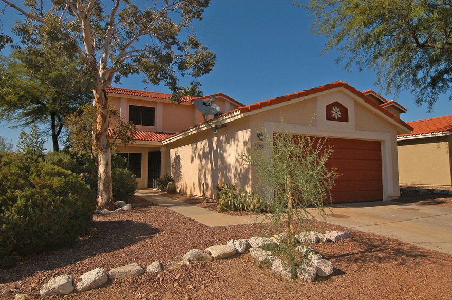 Optimum location provides privacy + gorgeous views.  Sited against a heavily vegetated arroyo, this fabulous home offers custom features w/the most desirable floorplan.  The entire 1st floor boasts a beautiful yet practical ceramic tile flooring.  A spacious bdrm complete w/murphy bed & 3/4 bathroom is conveniently located on the 1st floor.POLY replaced in 2011. New swamp cooler in 2015,New furnace and A/C in spring 2016. Newer appliances.   Freshly painted in rich, welcoming colors w/complimentary new plush carpeting upstairs.  The master suite boasts a window seat, walk-in closet & dual sinks.  Enjoy the fireplace in the living room or pass thru the high-end french doors of the family rm to a huge covered brick-pavered patio to enjoy views of the lush, mature citrus, p POLY replaced & All new plumbing in 2011 that includes 2 exterior shut off valves.One is whole house and separate one for landscaping irrigation.New swamp cooler in 2015
New furnace and A/C in spring 2016. Newer appliances .Termite treatment 8/16.HOA has 2 pools.