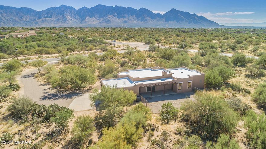 Custom 3BR 2BA (2,326 sq ft) home in La Cholla Airpark resting on 6+ acres with access to a private 4,670 ' runway and zoned for horses. Great room showcases foyer entry, living area with built in wood burning fireplace, and Formal Dining Room. Chef's kitchen features Breakfast Nook with picturesque bay window, decorative wood cabinetry, granite countertops and backsplash, and built in wine rack. Master suite hosts luxury bath with dual sinks, soaking tub, plus large walk-in shower. Tasteful Porcelain flooring in all high traffic areas. Laundry Room has granite countertop w/utility sink. Rear covered patio has access to garage, master bedroom and great room. Extra large two car garage includes attached cabinets and space for storage. Lot has room for RV. Catalina and Tortolita Mtn Views!