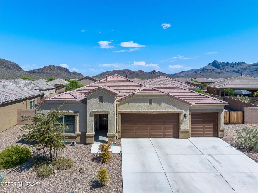 Incredible chance to assume a low 2.5% loan for this outstanding gated Marana home, the ''Earhart'' model nestled within the enchanting 55+ Saguaro Bloom Community. This 2-bed, 2-bath residence offers a vast lot with ample space for a pool and boasts a convenient 3-car garage. The kitchen is a true delight, featuring elegant granite countertops, stainless steel appliances, and an inviting open layout. Step outside onto the charming patio adorned with interlocking pavers, perfect for unwinding or hosting gatherings. Enjoy the warmth and ambiance of the fire pit during cozy evenings. Additionally, this home is ideally located near one of the many nearby parks, and it's just a short stroll to the fabulous community pool and recreation center. Noteworthy upgrades include: 8-foot front and slider doors, LED ceiling lighting in all rooms, and a dedicated 20 Amp circuit in the garage. Experience modern living in this remarkably energy-efficient property, nestled in a sought-after gated community, conveniently close to shopping amenities.
Don't let this opportunity slip away; make this Marana gem your very own!