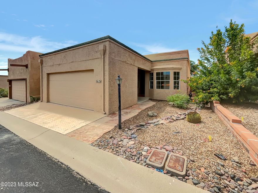 Move-in ready, updated beauty! This split floor plan home boasts LVP gray floors, fresh modern paint, and an inviting ambiance. The updated kitchen features SS appliances, double sink, ample cabinets, and a cozy breakfast nook. The combo LR/DR offers comfort with 2 ceiling fans and sliders to the AZ room. Enjoy the wood-ceilinged AZ room with serene views—no rear neighbors. The primary BR impresses with a ceiling fan, AZ room access, and a walk-in closet with built-ins. The updated primary bath shines with 2 sinks, walk-in shower, and solar tube lighting. A well-appointed guest bath, poly pipe-free, and a roof recoated in 2022 gives piece of mind about this well-maintained home. Plus, Green Valley Rec access!