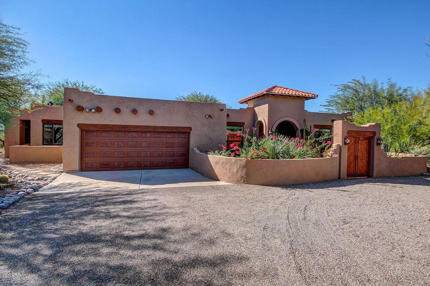 Enjoy Arizona sunsets in private resort style home located at end of cul-de-sac on almost an acre. Stunning Mountain Views from front and back. Newly Remodeled Pebble finish Pool and Spa surrounded by lush landscaping and secluded Fire Pit. This Sante Fe home has Open Floor Plan with Updated Stainless Chef's kitchen, Great Room with Wood Beam ceilings, Living Room and Formal Dining room. Master Suite has Kiva Fireplace, 3 Large Closets. Located in desirable Catalina Foothills School District. Amenities: Central Vac, instant hot water recirculating pump, AZ Room and Patio misters. Recent Upgrades: NEW Roof, 23 Double Pane Low -E window units, NEW Paint Exterior and Interior, Kinetico Water Softner & Purifier, NEW Hot Water Heater, Rogos Concrete Floors. See Attachment for list of Upgrades.