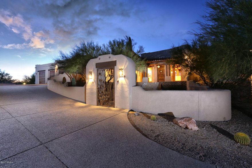 Meticulously maintained custom built home within small, gated enclave. Situated on 3.5 + acres of total privacy & open sky. Thoughtfully built & designed, unobstructed views upon entering the home through an inviting courtyard. Open, spacious, greatroom floorplan perfect for entertaining. High tongue & groove & beamed ceilings, walls of windows & lots of natural light. Open kitchen overlooks backyard & pool, has hand crafted cabinetry, expansive granite counters include island & bar seating. Luxurious main master suite (there are 2) with patio access. Stunning resort style pool with swim up bar, ramada & kitchen! Enjoy easy access to miles of trails for riding & hiking  Saguaro National Park. Impeccable, oversized garage with workshop & storage rm. 3 stall horse facilities, lights & wat