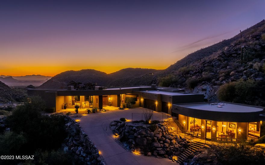 One of the most spectacular locations in Canyon Pass. Nestled into the rock outcroppings & boulders of an elevated lot, this contemporary design boasts warm finishes of stone, wood & granite  throughout. A massive Viking kitchen - view windows everywhere - dramatic walls of glass - some arched designs. Privacy abounds from master bedroom private patio - backyard entertainment areas and the spectacular guest house (that was built in 2008 by same builder as main house. HVAC systems new in 2021. Seller also added mini-split AC unit in garage.  Guest house is spacious at 945sf w/family room, dining area, separate bedrooms & bath &  mini bar kitchen area. Some of the most dramatic views of the canyon are from the guest house. This home is magnificent - sunsets are mesmerizing - architecture is stunning. Home sprawls smoothly - a soft sense of serenity. All furnishings are available - including the Steinway & Sons baby grand, a plethora of exercise equipment, tables, couches, accessories including a fully furnished guest house.  Feel free to call at any time to discuss.  Appointment required to view.