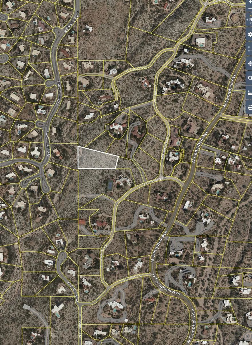1.99 acre lot with exceptional mountain, city and sunset views located in the heart of the Catalina Foothills. Incredibly convenient location. Lot allows for one home to be built.  Land is adjacent to the noted ''Lee Marvin Residence'' located just off Campbell Avenue between the University of Arizona and La Encantada Mall.  Buyer to independently verify all desired information. Enjoy privacy and proximity at this convenient foothills location.