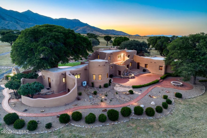 Impeccably preserved Pueblo Deco home on 6 acres in prestigious King's Ranch Estates at Coronado. Enjoy Southern Arizona's prized twinkling night skies with panoramic views of the valley and surrounding mountains. Named to the National Register of Historic Places, main house features 3 bedrooms, 3 full baths, 2 powder rooms. An abundance of features include: Kiva room in guest house, wood and Ocotillo ceilings, hand carved wood corbels, wood burning fireplaces, original wood and stone flooring, artistic tile work throughout, handcrafted cabinetry, and roof top decks. Detached 4 car garage provides additional storage, workshop and private bathroom. Buyer to verify all facts and figures, including those in the MLS. Listing agent is related to seller.