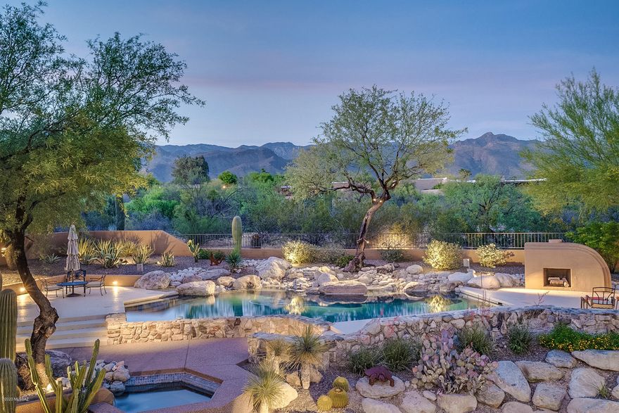 Magnificent Campisano Contemporary Situated Within Walking Distance of Canyon Ranch, Includes Commanding Catalina Mountain Views From The Resort Style Backyard With Pool, Spa, Water Feature, Fireplace, Gas and Charcoal Grills. This Home Features 4568 sq ft With 5 Bedrooms,4 Bathrooms, Study and Abundant Storage. Large, Lower Level Family Room Anchored by Built In Wet Bar, Private Guest Quarters and Bathroom With Steam Shower. Split Floorplan Allows Master Suite Privacy With Sitting Area, Study, Expansive Bathroom With Soaking Tub and Shower, Plus Extra Large Closet. Incredible Kitchen Features Granite, Butcher Block Island, Double Ovens, Induction Cooktop, Walk In Pantry And Built In Desk/Storage Cabinets. Pella Windows Throughout. 2 car/1 car garages. This Fantastic Property Must Be Seen!