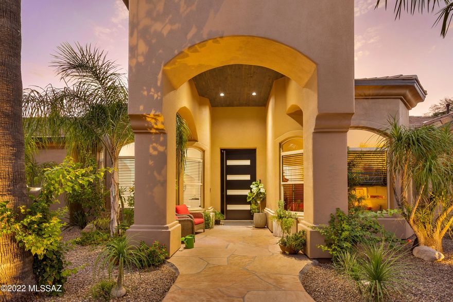 Stunning contemporary MODERN home! The aesthetic & craftsmanship of this complete remodel will surely impress! Upon arrival, you are greeted with impressive curb appeal. Step inside to a custom front door and be welcomed by a beautiful floor to ceiling tiled fireplace featuring 18' ceilings. Open floorplan features high-design kitchen with modern wood cabinetry, quartz & granite countertops, featuring a large island with waterfall quartz, wooden shelves & state of the art appliances. Sliding glass doors that lead from the living space to the covered patio provide a seamless transition between indoor and outdoor living. Retreat in the privacy of this resort style back yard, enjoy an outdoor grill & kitchen or head over to the pool to soak up some sunshine. Schedule your showing today 3 car garage includes mini split AC and modern epoxy floors. Additional 2 car garage includes walk in storage to provide ample storage space. Enjoy the beautiful wooden indoor beams in living area adding elegance to your space. Outdoor patio ceiling includes wood paneling throughout for an extra luxury touch. Panoramic mountain views and greenery through the picture windows, bringing in lots of natural light. Come take a look at all this home has to offer!