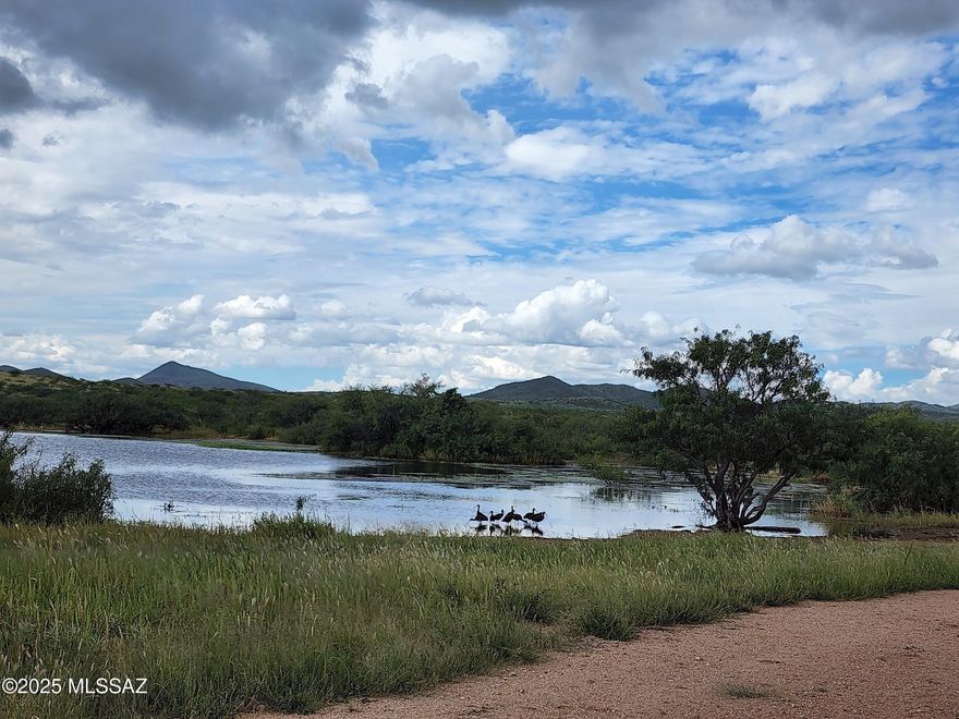 MOTIVATED SELLER!! MASSIVE $1,000,000 PRICE REDUCTION! The Double U Ranch, is a historic, working cattle ranch situated approximately 13 miles east of Tombstone, SAZ. It is one of the most user-friendly ranches for both the new & most experienced cattle ranchers anyone could ever hope to find. The ranch spans a total of 9,555 acres & is located at the end of the road creating ultimate privacy. This includes 6,315.07 adjoining deeded acres & an additional 3,240 acres under an Arizona State Land Grazing Lease making this one of the largest contiguous ranches in Arizona. It consistently supports 300+ head year-round of Angus & Brangus cattle & the sellers have carried 600 AU in prior years.   
The ranch is extremely well watered, equipped with 12 registered wells, 7 solar pumps, 4 windmills 4 dirt tanks, pipelines & numerous drinkers are strategically placed throughout the ranch ensuring cattle have water available every quarter mile or so. 

Unlike most high desert areas, the Double U Ranch contains a vast amount of sandy loam soil crisscrossing throughout the property, aiding the lush natural growth of nutritious grasses and brush, with mesquite trees, cottonwood and even some black walnut trees brought in by the original homesteaders! This healthy vegetation and rainfall have historically supported the strong AU numbers. You will never grow tired of the views. They are incredible in every direction and from every location and season on the ranch. 
The annual climate is very mild and comfortable. The winter days are in the low 60's and nights average 36 degrees. Summer days average 90 and nights in the mid 60's. The annual precipitation is 14 to 15 inches. 
Located at the southern tip of the scenic Dragoon Mountain range, the rolling topography ranges from 4,500' and rising to 5,280' atop Hay Mountain. There is an old signal beacon located on top due to the expansive 360 degree views. There is also an old historic stagecoach stop located on the ranch. 

The ranch is home to abundant and diverse wildlife, including Mule Deer, White Tail Deer, Javelina, Coyote, Foxes, Cottontail and Jackrabbit, Mountain Lion and Bobcat. Bird species such as Hawks, Falcons, Roadrunners, Eagles, Ducks, and White-Faced Ibis also inhabit the area. You will also find Dove and remarkably this area has all three Arizona Quail species - Gambel, Scaled and Mearns Quail. 
The ranch fencing and cross fencing is good with numerous pastures. The perimeter gates are locked by the owners and the interior roads are private. This has many positive benefits for day-to-day ranch efficiency and creates a private game refuge where the hunting is excellent and trophy bucks are common.  

Improvements on the ranch include a historic 1,847 sq ft, 3-bedroom, 2-bathroom house with a covered front patio. Additional structures comprise a separate bunkhouse currently used for laundry and storage, stock pens adjacent to a large 20 x 60-foot quonset building with a concrete floor, a 20 x 20-foot tack room, a machine shop, and a hay barn. Steel-piped pens and wood corrals surround a large squeeze chute and two calf tables, along with a 10 x 12-foot cattle scale and loading chute. Electric power lines and a propane tank supply the headquarter improvements. The ranch is offered with equipment available separately through a private treaty.
      
There Double U Ranch has so much potential.
The ranch is free of any Conservation Easements making it even more rare on a ranch of this great size in today's market. However, it remains an option for the new owner to place a Conservation Easement on the ranch or even part of it. The new owner could create this easement which may create substantial tax benefits. Please check with your CPA or tax attorney for verification and details. 
The buyer also has another angle to consider here due to all of its positive attributes already mentioned especially the beauty, water availability, access and location close to Tucson and Phoenix; it is a prime candidate for a subdivision.

With its dramatic beauty, diversity of the land, strong vegetation, stunning views, great access, historic location, mild annual climate, excellent carrying capacity and very attractive price make this ranch hard to pass on. You will be very hard pressed to find a better working cattle ranch on the market anywhere in Arizona today. Come visit and make this legacy ranch yours. 
             
Tax Parcels: 111-01-004D, 111-25-001A, 111-25-001B, 111-25-001C, 111-01-004C