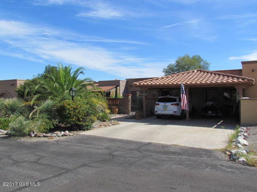 Nicely updated townhome in Townhome 4 with mountain view-back, front and back courtyards with water fountain in front on quiet Cul-de-sac/Mostly Sal-teal floor tile with Berber carpet in both bedrooms/No home behind-desert/HVAC rpld 2011/Stove rpld 2014/Frig rpld 2015/Interior painted 2016/Microwave new/Hall bath new vanity, sink-faucet, toilet, and shower head/Master bath new shower head/New lighting LR-DR/New element-fireplace/Garden window-kitchen/Water filter system/5 skylights/2 bifold closets-master/Private backyard with drip system/Work bench and storage cabinets in carport