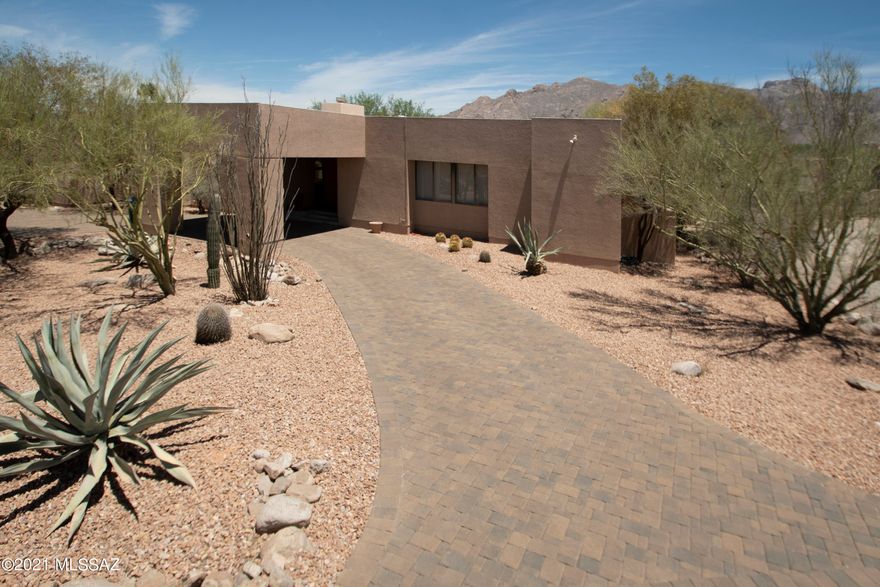 Located in much sought after Shadow Hills, this contemporary split floorplan 3,383 SqFt 4 bed/4ba won't last long! It has 2 master suites, living room, family rec room, dining area and eat-in kitchen with breathtaking Catalina mountain views. Granite kitchen boasts huge breakfast bar overlooking the large backyard & magnificent mountain views. High ceilings, lots of natural light, tons of storage, and a spacious backyard with covered patio make this a wonderful family home! One of the few Shadow Hills lots without a pool but plenty of room to add one. The large family rec/office is great for entertaining. Front entrance with shaded portico. Newly painted exterior (May 2021), all new LED lighting and a beautiful paver driveway are some of the updates.