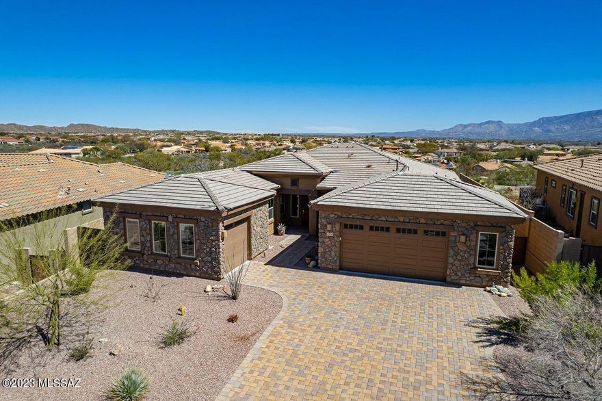 Nestled in the heart of Oro Valley this gorgeous 3 bdrm + Den/3 bath 2018 Lennar built home backs up to open space. With Split bedroom floor plan, the large Primary Suite includes 2 walk-in closets, walk in shower, large dual sink vanity. Extra large laundry room & storage. Expansive 10 ft. ceilings, open concept great room, gourmet kitchen with SS appliances incl. 2 ovens, a large granite island, and a walk in pantry, plus additional dining room; this home is perfect for entertaining. Experience the blue AZ skies and views of both the Catalina & Tortolita Mts from the covered patio; a perfect retreat for morning coffee or a glass of wine. Just a short stroll to the private entrance of the HOA-owned Hohokam Park. Plenty of parking w/both double and single car garage. The 2 car garage is an extended width Garage. There is also an additional single car garage for a total of 3.