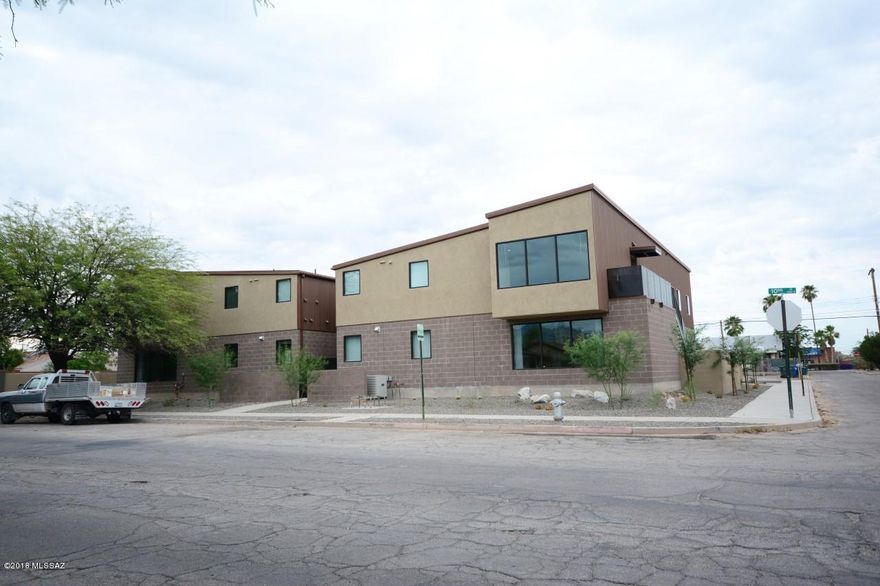 Rare opportunity to purchase newer construction within 3 blocks of UofA around a 8.8% Cap rate! This newer building integrates metal roofing with block and stucco finishes for a really neat modern look that the students love. 4-plex, with 8bds/3.5bths per unit. Large units with huge common areas, all tile throughout, hardwood cabinets, corian counters, and ample appliances. Floorplan designed by and for students. Pool, Large Parking lot, basketball hoops, and fully enclosed yard and common area.Fully leased through July 2018. Full package available.