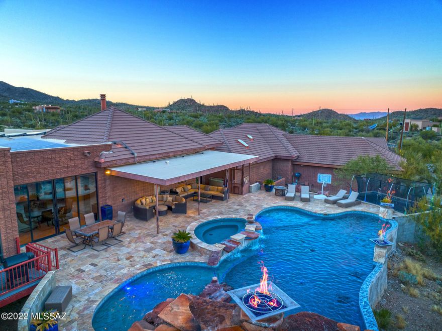 Spectacular! Seller will entertain offers/counter offers between $1,625,000-$1,675,000 for this custom home on 25 private acres.  Outdoor living at its best bordering Federal and State land. Panoramic mountain and city views. Stables for your horses and the ultimate 4500 sqft RV garage. Bring your car collection, toys or boats to fill the additional four garages. State of the art pool with a built in bar, spa, waterfall and additional lighted features. Impressive media room with built in bar, surround sound and custom lighting, Pool table stays along with the audio visual equipment and  media chairs. Handcrafted kitchen overlooking the great outdoors, three cozy fireplaces and separate quarters for your family or guests. Includes a full kitchen, bathroom and loft with it's own entrance. Bring the entire family to this outstanding home that has it all including owned Solar to help save on the energy bills, and a fully paved road to reach this incredible location.  Close to 1-10, downtown, schools and shopping.