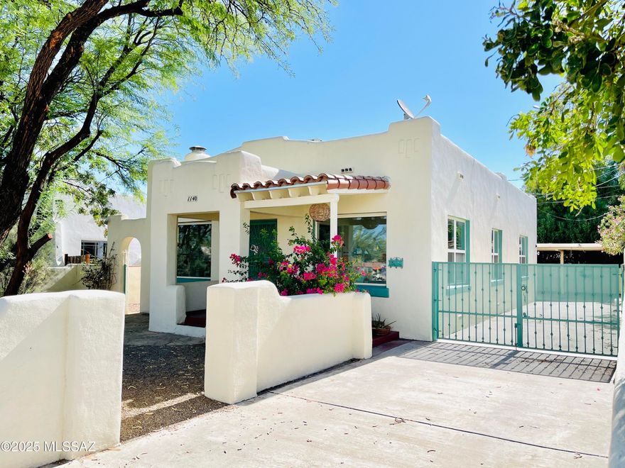 Don't miss out on this Charming Santa Fe Bungalow in central Tucson! Minutes away from University of Arizona, UMC/Banner Hospital, downtown, I-10 freeway, restaurants, shopping, & so much more! Beautiful desert landscape. Welcoming you home to a fireplace & lots of light through beautiful custom-made stained glass window features. Hardwood floors throughout that walk you past dining room up to open-concept kitchen overlooking living room -perfect for entertaining. Kitchen has lots of counter space with windows + skylight that fills the space with lots of natural light. Past the kitchen is a den with access to backyard & primary bedroom. Carport in back for secured covered parking plus shed! Tenant occupied until 06/22/2026