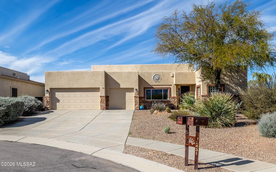 Oro Valley Sanctuary: 4 bed, 3 FULL baths, 3-car-garage, nestled on LARGE, PRIVATE, CUL-DE-SAC LOT w/VIEWS! Front exterior features: long driveway, mature vegetation, stacked stone elevation, custom wrought iron door, brick paver patio to enjoy Catalina Mtn views! Highly upgraded interior w/12ft ceilings, over-sized tile flooring (NO carpet), upgraded baseboards, multiple exits to outdoor patio & pool, 2 living/dining areas, split floor plan, gourmet kitchen w/huge breakfast bar, built-in desk, extended cabinetry storage & counter space, gas cooktop, updated primary bath w/double vanity, gorgeous soaking tub, walk-in shower w/modern tile surround, spacious primary w/2 closets & views of rear yard oasis: large covered patio, flagstone, outdoor kitchen, turf, & sparkling pool! SEE VIDEO!!