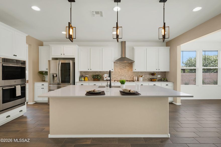 Modern living on a premium homesite offering exceptional privacy, with only one neighboring home sharing the private lane. This spacious 2-story home features 2,463 square feet with 3 bedrooms, 3 bathrooms, a versatile loft, and thoughtfully designed living spaces throughout. Assumable VA loan available for qualified buyers. Leased solar helps with energy efficiency. The chef's kitchen is the heart of the home, complete with quartz countertops, a tile backsplash, an oversized island, gas cooking, a walk-in pantry, and a convenient pocket office just off the kitchen, ideal for work, homework, or daily organization. Upstairs, the expansive loft provides flexible space for a media room, playroom, fitness area, or additional living space. A massive under-stair storage area offers room for seasonal décor, hobbies, or extra organization. Step outside to the oversized backyard featuring a refreshed pool and pool decking. Additional highlights include an oversized 2-car garage, extended driveway with parking for 3 additional vehicles, and a location within walking distance to the elementary school, minutes from shopping and dining, and approximately 10 minutes to I-10 access.