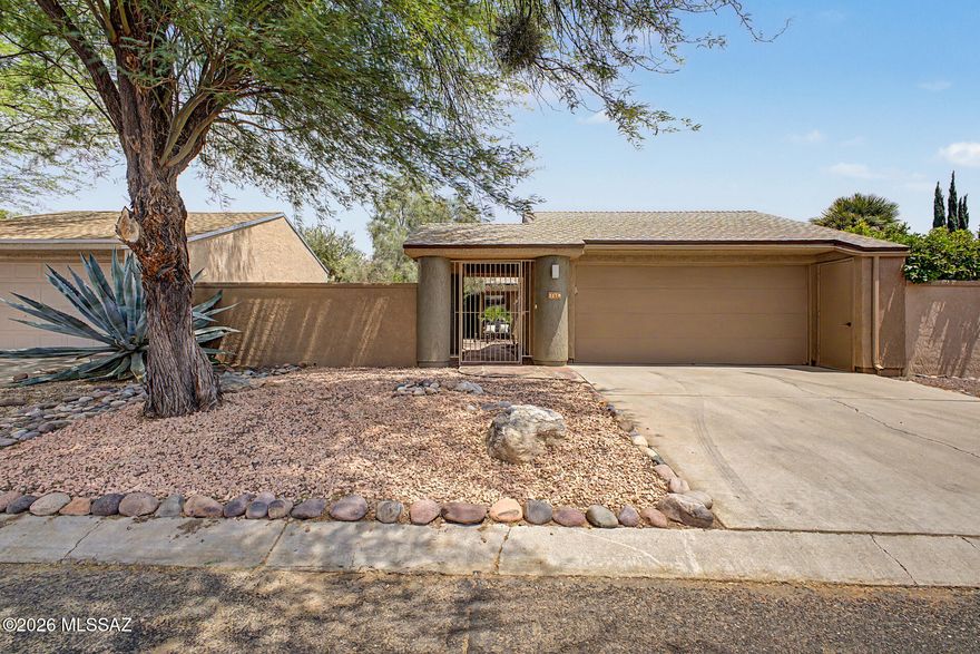 TURN-KEY and move-in ready! Beautifully updated 2-bedroom, 2-bath home with a 2-car garage in the desirable Bosques Creek neighborhood! Roof redone in 2024. Residents enjoy access to the beautiful community pool, as well as the scenic bike and walking trail along the Rillito River. The community has a 13 acre private natural preserve /habitat as part of our amenities. Surrounded by green space and outdoor recreation opportunities, this home is perfect for nature lovers and outdoor adventurers alike. This charming property welcomes you with a privately enclosed front courtyard. Inside, you'll find vaulted ceilings, skylights, abundant natural light, and stylish tile and beautiful vinyl flooring throughout. The open-concept living and dining areas create an inviting space perfect for for relaxing or entertaining.

The upgraded kitchen features stainless steel appliances, Corian countertops, recessed lighting, designer tile backsplash, a decorative pantry cabinet, white shaker cabinetry, and a peninsula with a stunning live-edge wood breakfast bar. 

The spacious primary suite includes a separate entrance to the backyard, a walk-in closet, and a beautifully designed ensuite bathroom with dual vanities, and a large shower with a glass enclosure. The secondary bedroom is ample size and features a private bathroom with a sliding barn door- ideal for overnight guests. 

Step outside to your peaceful backyard retreat complete with mature landscaping, paver patio, and low-maintenance artificial turf. Don't let this gem slip away!