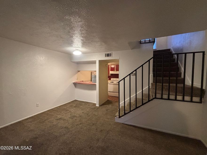 This well-kept 1-bedroom, 1.5-bath loft-style condo located on Tucson's east side. The first floor features a breakfast bar, living room, and a half bath. The kitchen is equipped with a stove, refrigerator, and dishwasher.
Upstairs, the loft-style bedroom offers generous natural light through large windows and includes a full bath.
Community amenities include a pool, along with covered utilities for water, trash, and sewer. The property is situated close to retail, dining, medical services, and major transportation routes