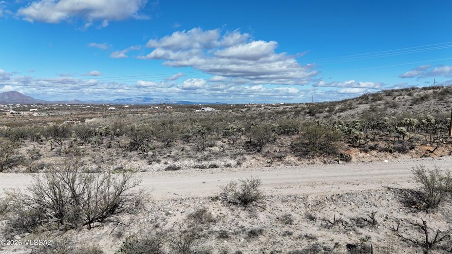 Lot runs along a ridge with some ground higher than the road, a house pad can be cut  for the building site.  Water is verified to be in the road and there are power lines there.  Great views.