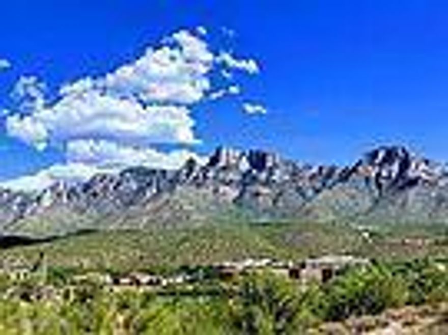 THE MOUNTAIN VIEWS ARE SPECTACULAR!!! High ridgeline view lot in a small, gated community in the heart of Oro Valley overlooking the Canada Del Oro wash from high above. Large building pad allows you to orientate your house in any direction. ALL PUBLIC UTILITIES ARE AVAILABLE: water, sewer, gas, electric & telephone.  Close to Oracle Rd. retail centers as well as several hospitals.