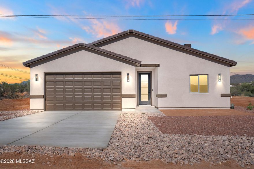 Welcome to this beautiful, brand-new 4-bedroom, 2-bathroom home, thoughtfully designed with comfort and style in mind. The open floor plan creates a bright, inviting space perfect for everyday living and entertaining. The gourmet kitchen features abundant cabinetry and sleek quartz countertops, blending modern design with everyday functionality.

The private primary suite offers a relaxing retreat, while the split floor plan keeps it separate from the additional bedrooms for added privacy. Out front, a unique landscape design enhances the home's curb appeal and creates a welcoming first impression.

Situated on a generous .47-acre corner lot, you'll enjoy plenty of space along with stunning mountain views right from your property.