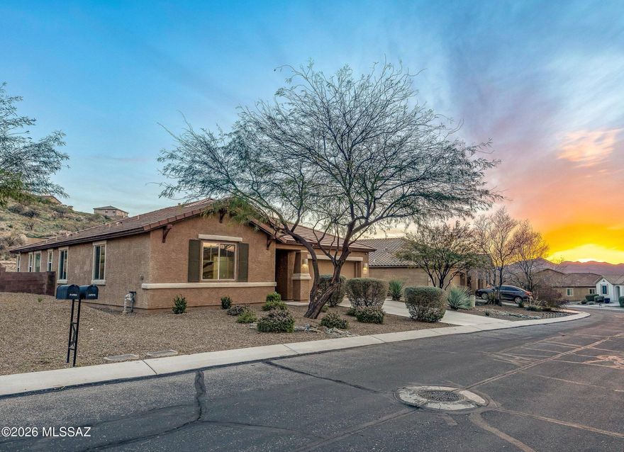 This spotless 3-bed 2-bath home with an additional den/office is freshly painted and ready for move-in! Many upgrades include tile flooring throughout, and a chef's kitchen with a huge island & walk-in pantry, stainless appliances, gas range, and wine fridge. The large primary suite features two walk-in closets, a soaking tub, & separate shower. The property backs to common area for incredible privacy, and the elevated lot features sunset views of the Tortolita mountains. The fenced-in backyard has a large covered patio, decorative turf, and a built-in charcoal bbq area. Come enjoy the community of Eagle Crest Ranch!